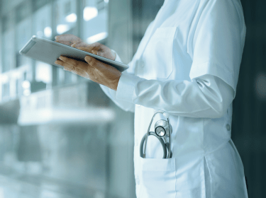 Doctor looking at results on a tablet