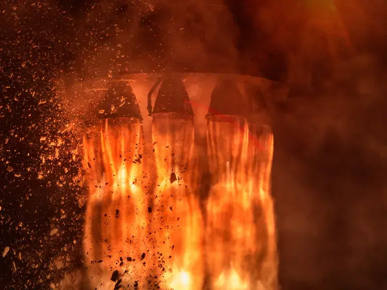 Rocket engines and fire duting the missile launch at night, close up conceptual image. Elements of this image furnished by NASA.